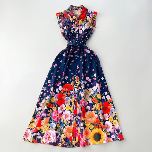 Front view of the Denise sleeveless navy maxi dress with vibrant wildflower print and matching blue belt.