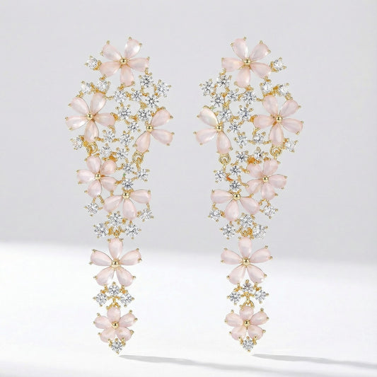 Pair of Eva long statement earrings with pink floral stones, crafted from copper, photographed on a clean studio background.