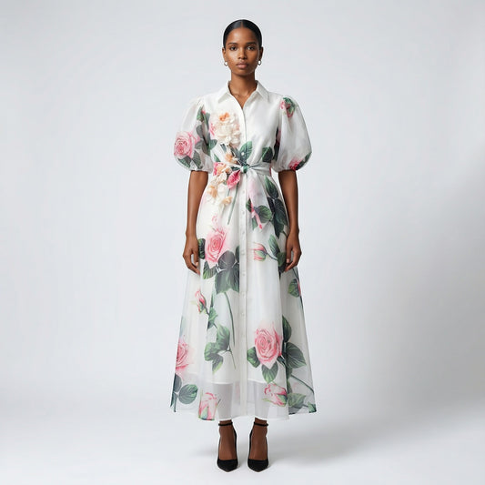 The Marie maxi dress in a 145 cm length featuring a long-sleeved ribbed knit bodice and a dramatic side-pleated accordion skirt with a matching waist belt.