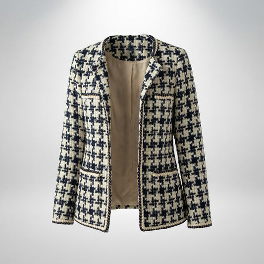 Close-up of Selina navy and cream houndstooth tweed jacket featuring gold braided trim and four front pockets.