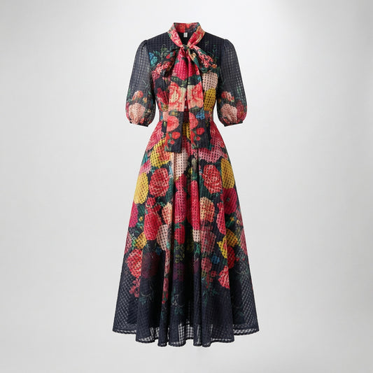 Solange 53-inch maxi dress featuring a sheer white plaid organza fabric with pink floral print and a pussy-bow neckline.