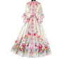 A floral maxi dress with long sleeves and a belt, featuring a variety of colors including pink, red, yellow, and blue on a white background.