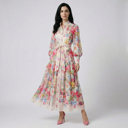 Full length view of the Abdulla floral maxi dress in pink and multicolor chiffon featuring lantern sleeves and a waist tie.
