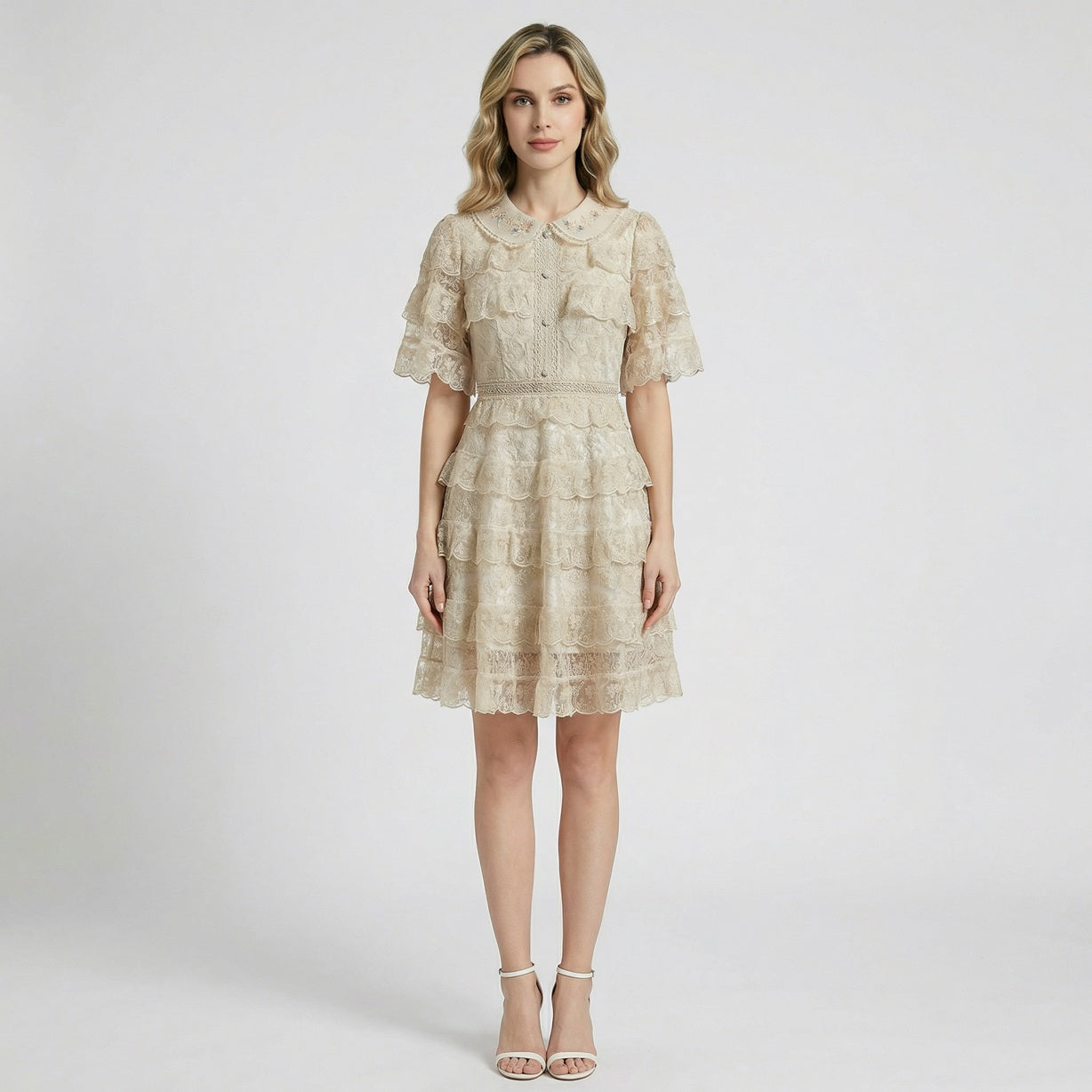 Adara tiered lace mini dress in cream with embroidered collar and ruffled sleeves.