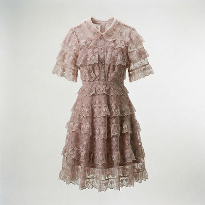 Adara tiered lace mini dress in dusty rose featuring floral lace and beaded collar.