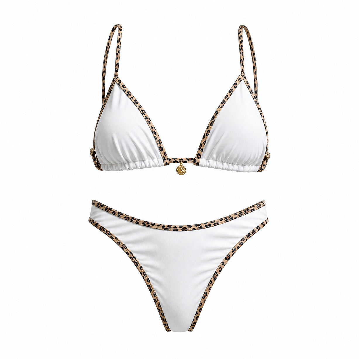 Flat lay of the Alessandra bikini set in black, white, and cream featuring leopard print contrast piping and a gold sun charm detail.
