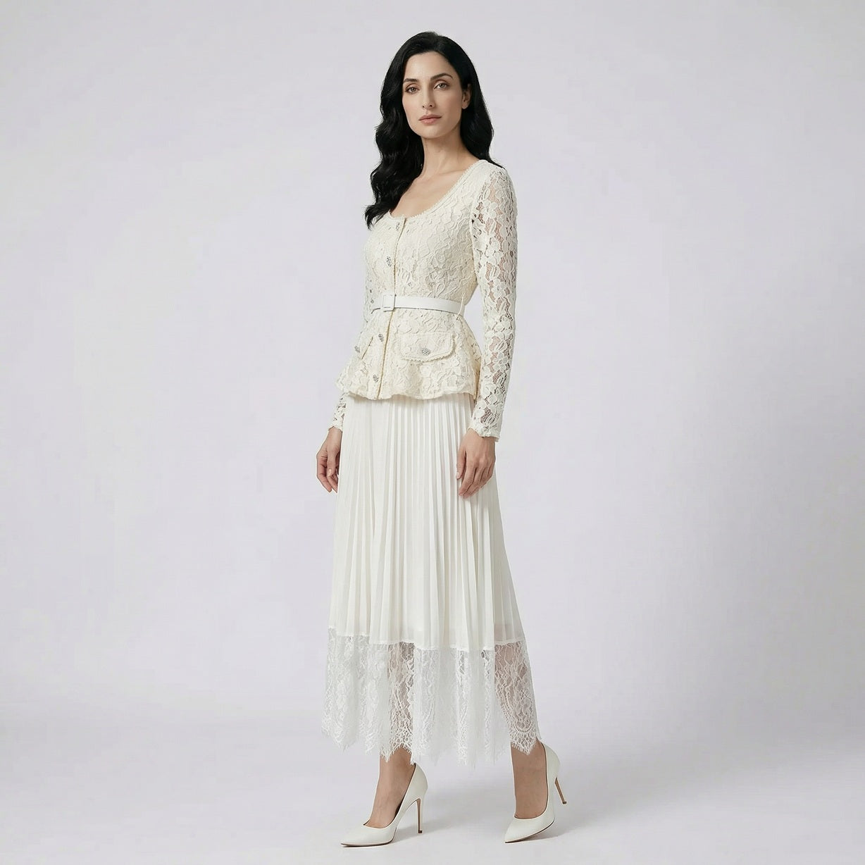 Elegant cream-colored Anitta lace peplum top and pleated maxi skirt set with jewel buttons.