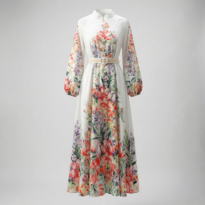 Front view of Annie floral print maxi dress in lavender and white colors with lantern sleeves and waist belt.