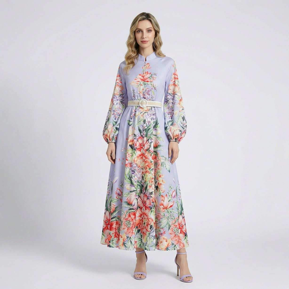 Front view of Annie floral print maxi dress in lavender and white colors with lantern sleeves and waist belt.