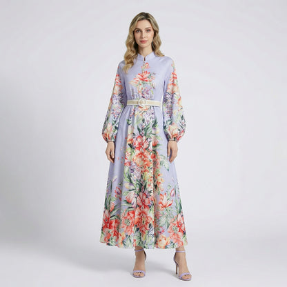 Front view of Annie floral print maxi dress in lavender and white colors with lantern sleeves and waist belt.