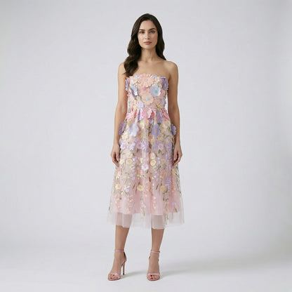 Pink Arlete strapless midi dress with multi-colored pastel 3D flowers.