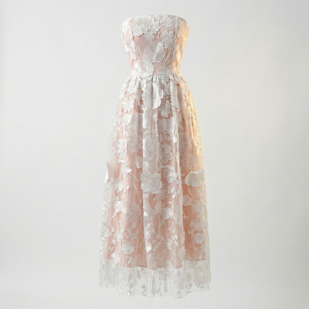 White Arlete strapless midi dress with pink lining and white floral embroidery.