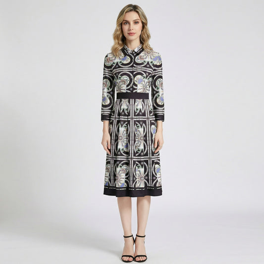 Woman wearing the Bianca black and gold ornate geometric print midi shirt dress with 3/4 sleeves and black heels.