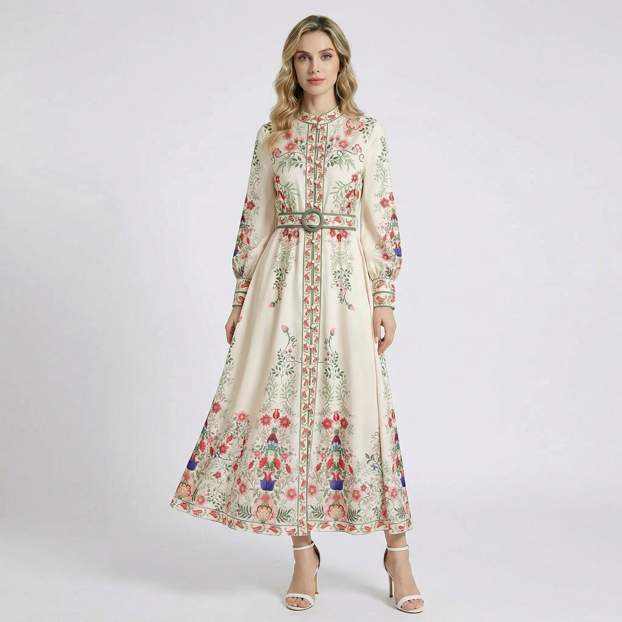 Front and back view of the Carmine ivory maxi dress with red and blue floral print, long sleeves, and matching waist belt.