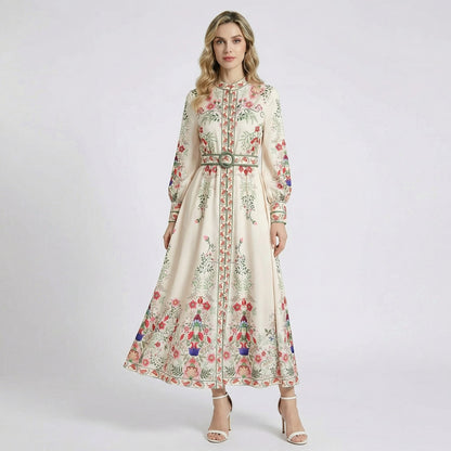 Front and back view of the Carmine ivory maxi dress with red and blue floral print, long sleeves, and matching waist belt.