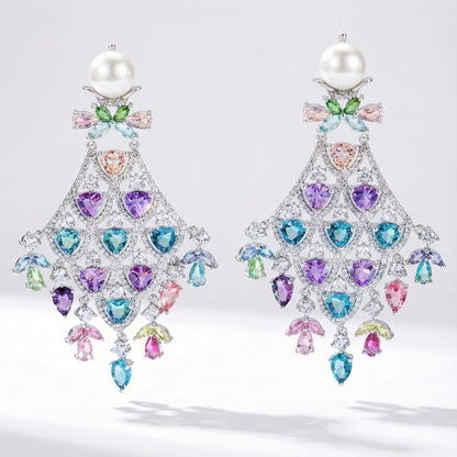 Colorful cubic zirconia chandelier earrings with large creamy pearl, pastel rhinestones, and silver metal for elegant and feminine look
