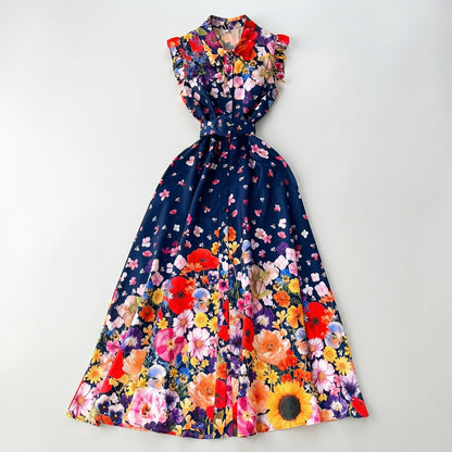 Front view of the Denise sleeveless navy maxi dress with vibrant wildflower print and matching blue belt.