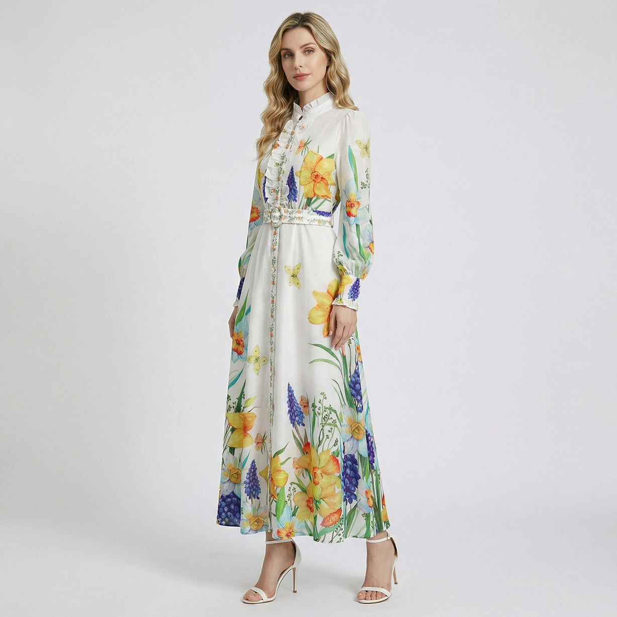 Elia white long sleeve maxi dress with yellow daffodil and blue hyacinth floral print and ruffled collar.