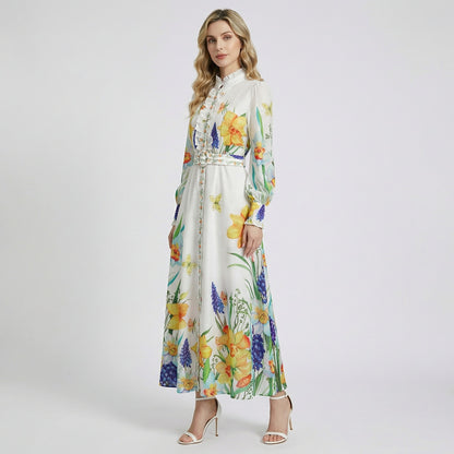 Elia white long sleeve maxi dress with yellow daffodil and blue hyacinth floral print and ruffled collar.