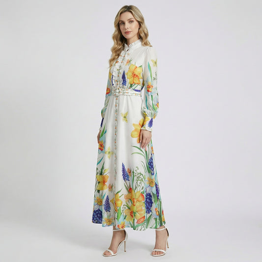 Elia white long sleeve maxi dress with yellow daffodil and blue hyacinth floral print and ruffled collar.