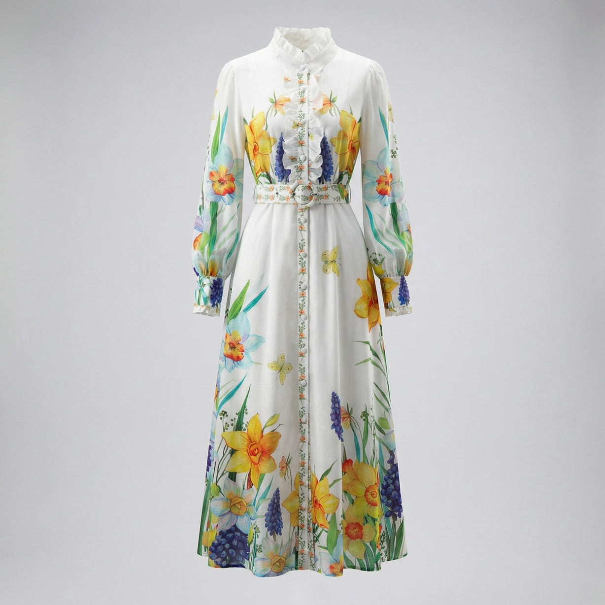 Elia white long sleeve maxi dress with yellow daffodil and blue hyacinth floral print and ruffled collar.