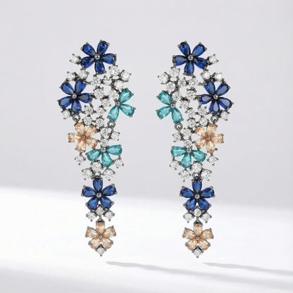Pair of Eva long statement earrings with multicolor floral stones, crafted from copper, photographed on a clean studio background