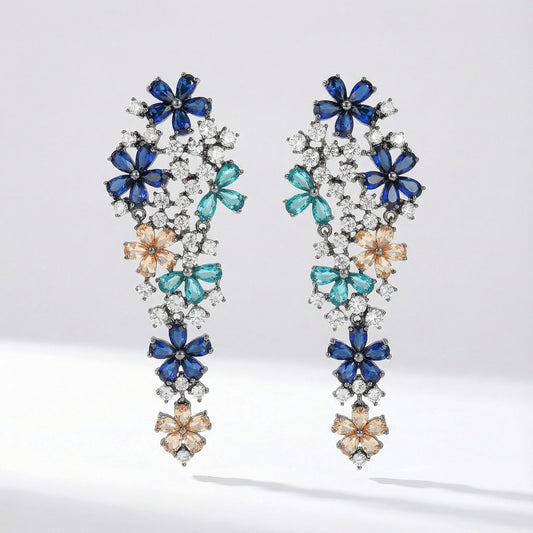 Pair of Eva long statement earrings with multicolor floral stones, crafted from copper, photographed on a clean studio background