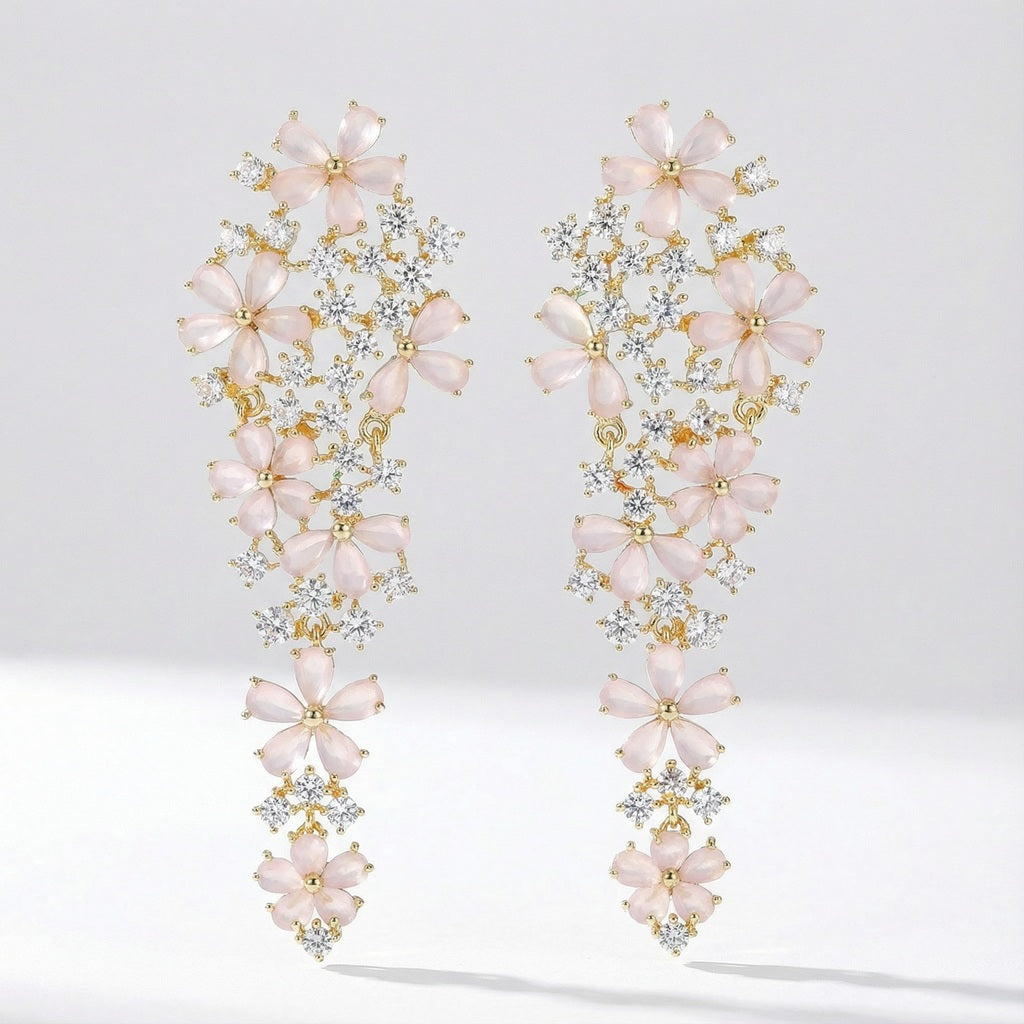 Pair of Eva long statement earrings with pink floral stones, crafted from copper, photographed on a clean studio background.