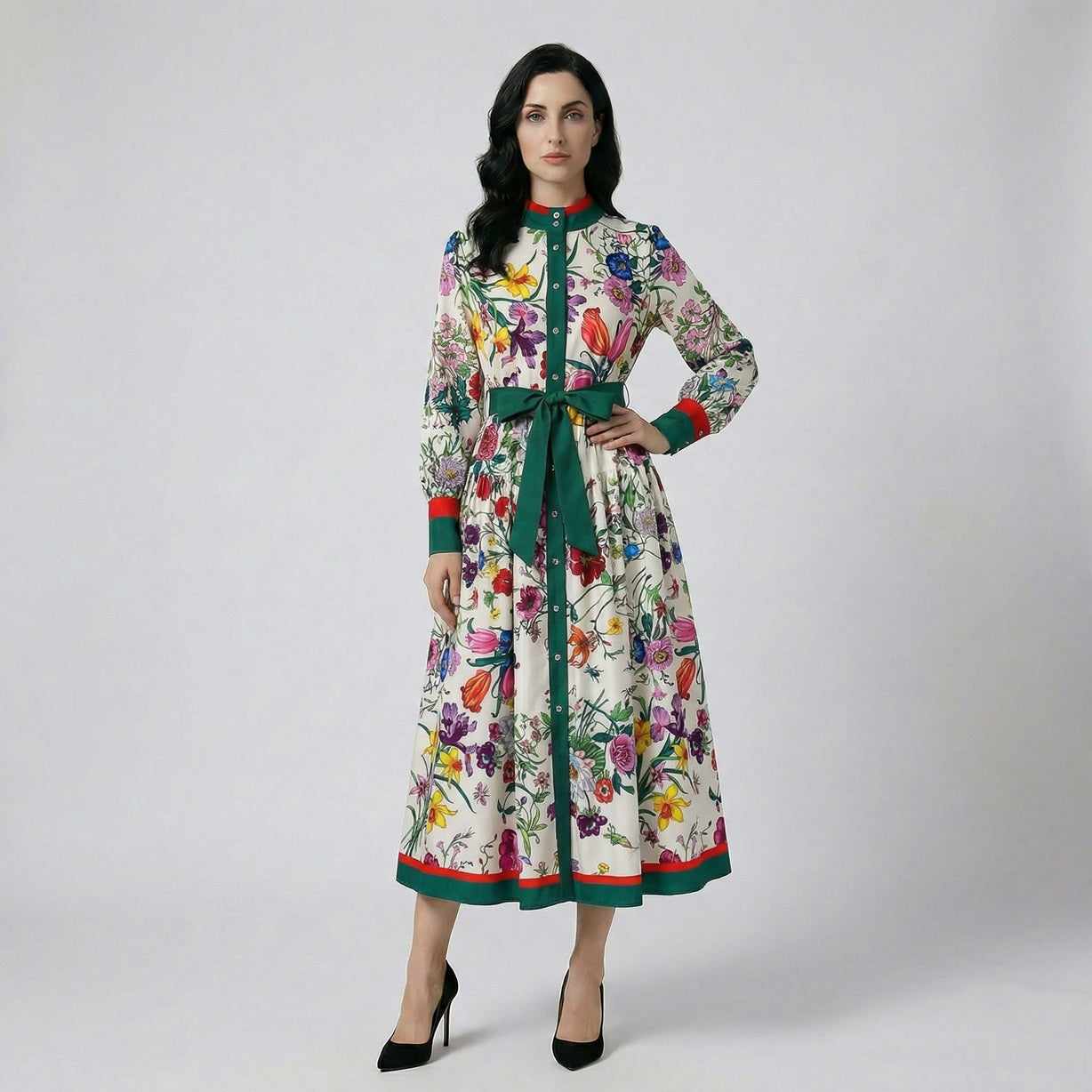 Full length view of the Eva floral maxi dress in white and black floral patterns featuring a green waist tie and 130cm length.