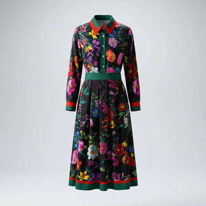 Flat lay of the Eva Midnight Black floral midi dress featuring vibrant flowers and red-green contrast trim.