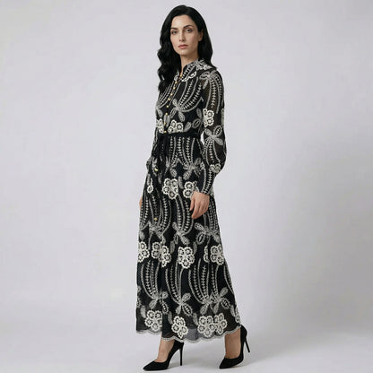 A woman wearing the Evelyn maxi dress, a 130cm floor-length elegant gown in black.