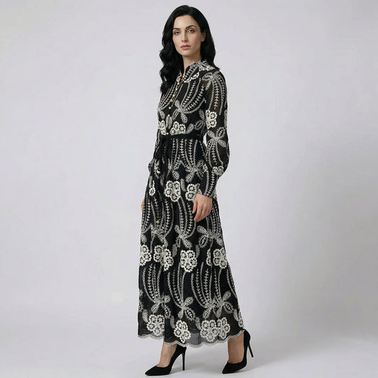 A woman wearing the Evelyn maxi dress, a 130cm floor-length elegant gown in black.