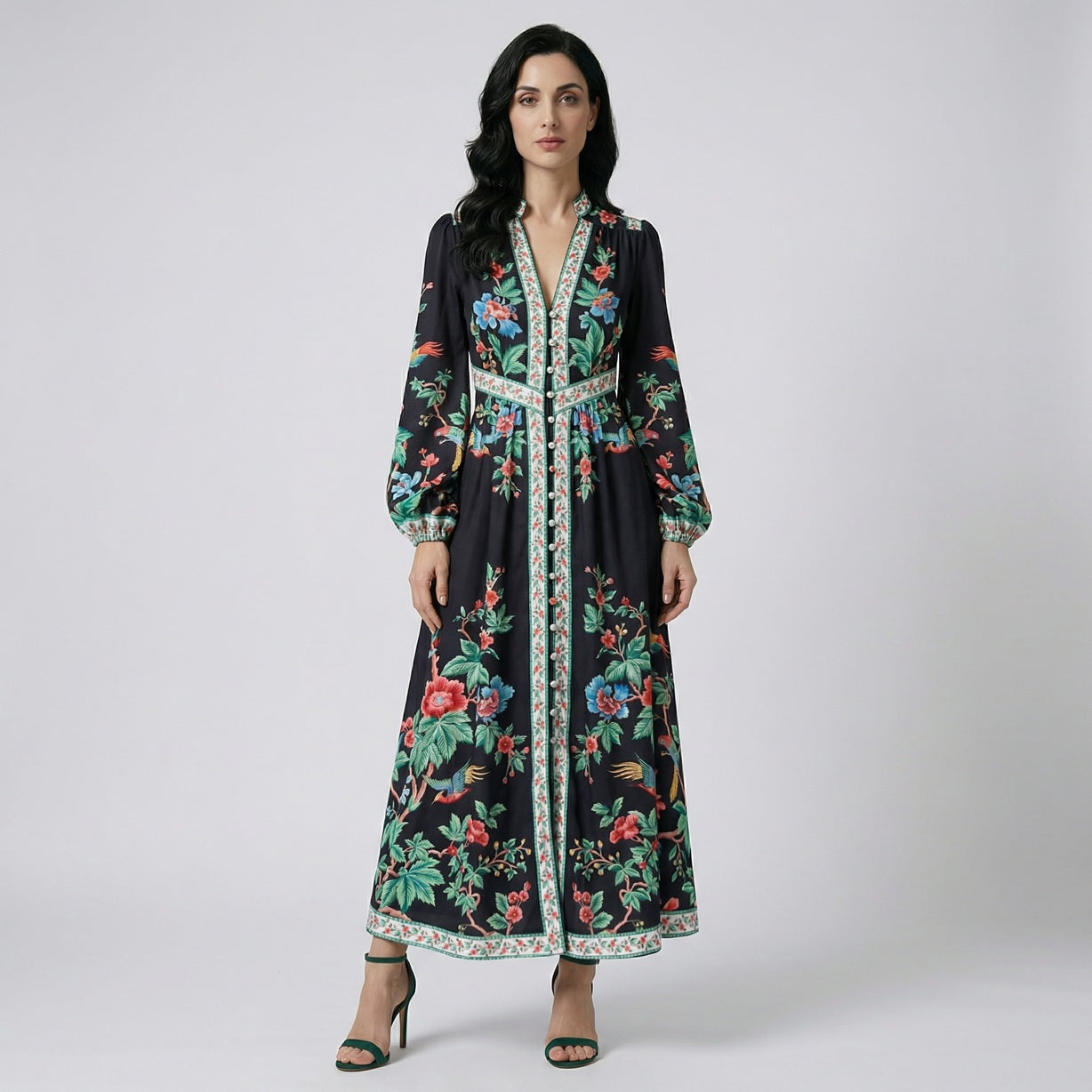 Fatema Black Chinoiserie Maxi Dress featuring vibrant red flowers and green leaves with button-down front.
