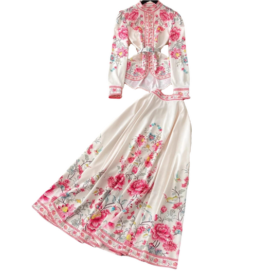Elegant two-piece floral print set featuring a belted long sleeve blouse and a matching flowy maxi skirt available in blue, pink, and black.