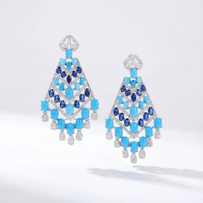 Hollywood Cleopatra blue rhinestone earrings with geometric design and clear cubic zirconia in silver metal