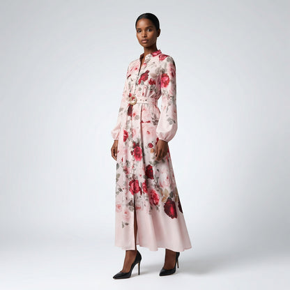 The Jana maxi dress in a 147 cm length featuring a long-sleeved ribbed knit bodice and a dramatic side-pleated accordion skirt with a matching waist belt.