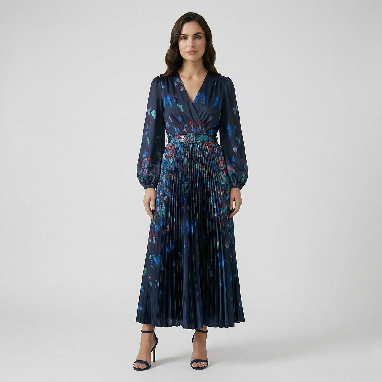 Front view of the Jane Butterfly Print Pleated Maxi Dress in navy blue featuring lantern sleeves and a buckled waist belt