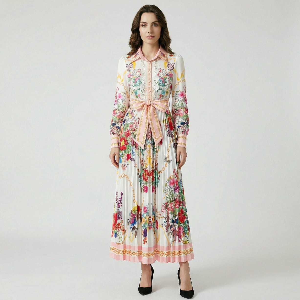 Front view of the Janet floral print pleated maxi dress featuring a pink collar, lace bodice, and waist tie