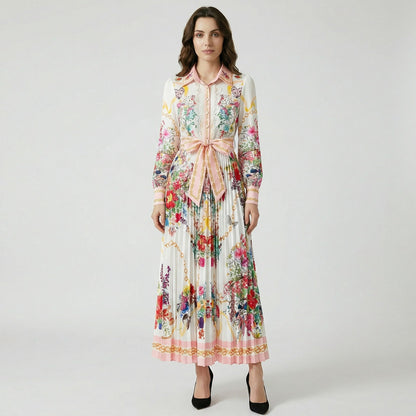 Front view of the Janet floral print pleated maxi dress featuring a pink collar, lace bodice, and waist tie