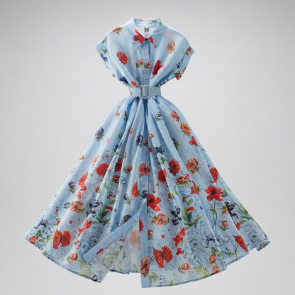 The Julie floral button-down midi dress in sky blue with red poppy print, featuring a matching belt and 47-inch skirt.