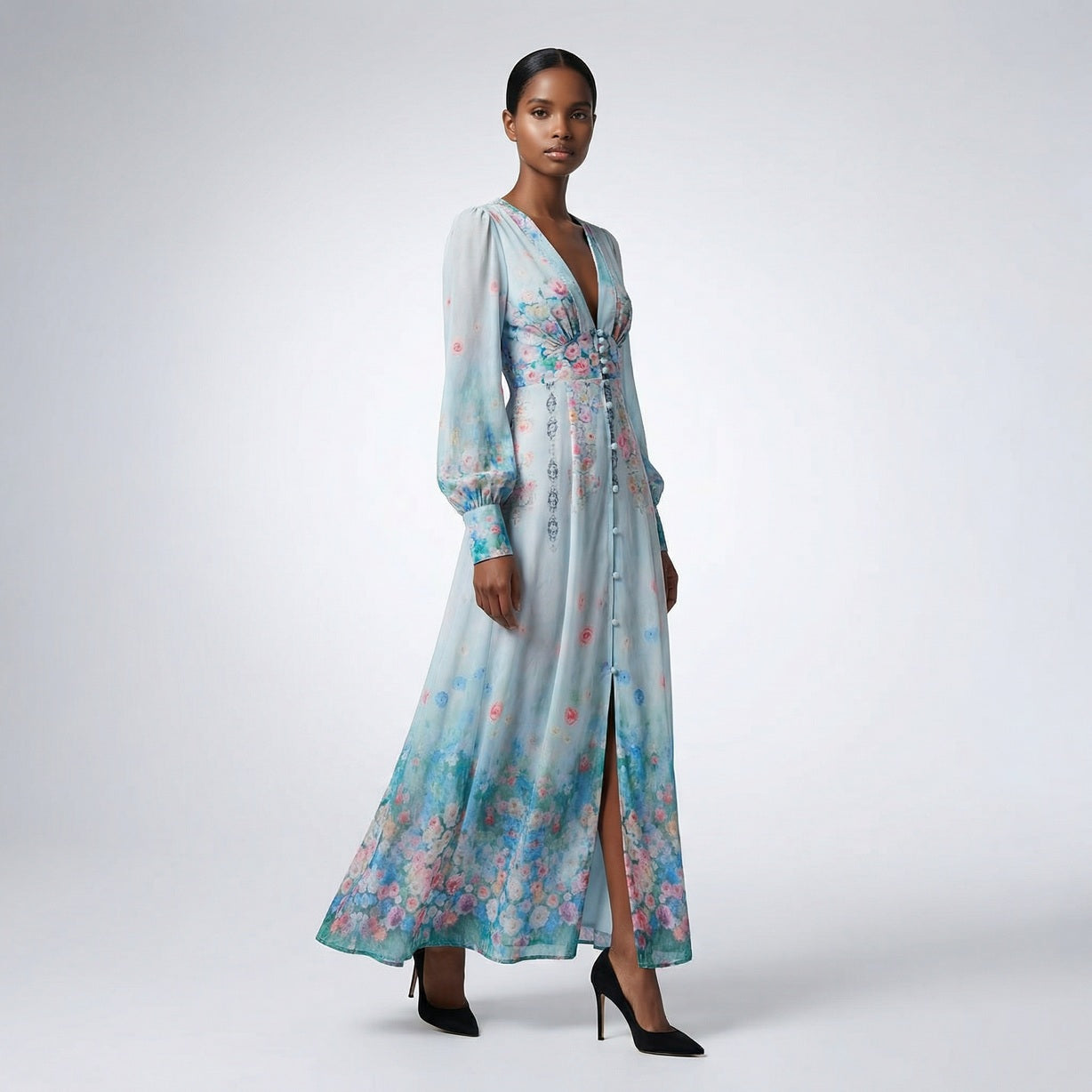 Front view of the Julie maxi dress in white featuring colorful floral and butterfly prints with a button-down front and V-neckline.