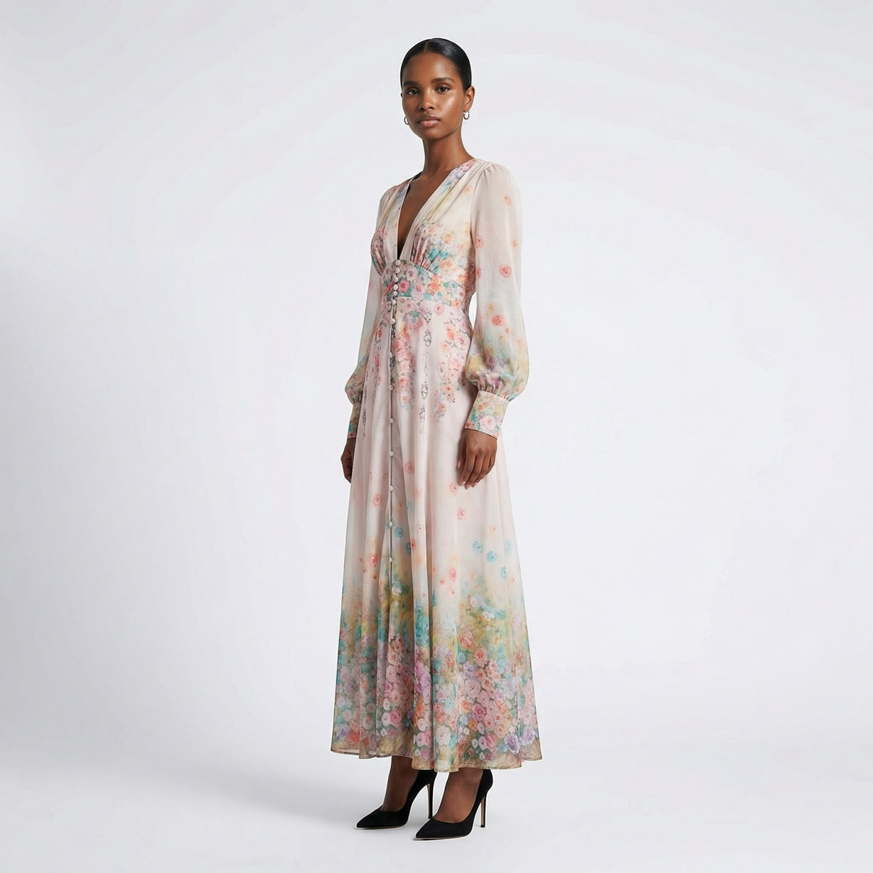 Front view of the Julie maxi dress in white featuring colorful floral and butterfly prints with a button-down front and V-neckline.