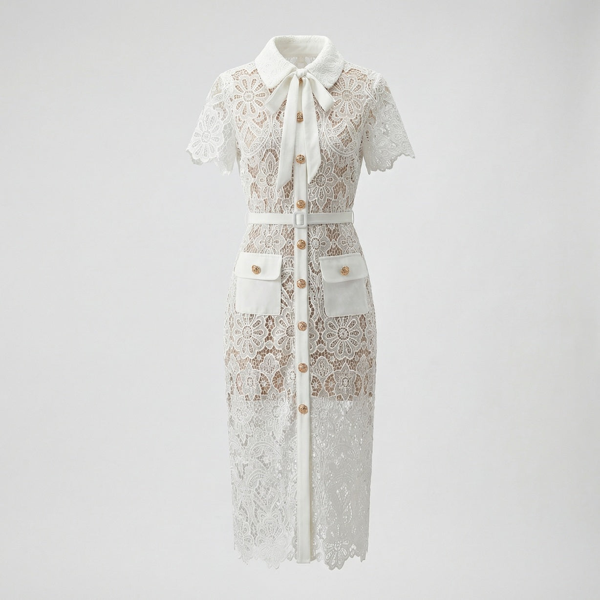 Front view of Lya white floral guipure lace midi shirt dress with gold buttons and bow collar.