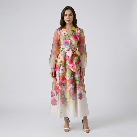 The Maja Maxi Dress in Pink Peony colorway showing bold pink and yellow floral patterns and long lantern sleeves.