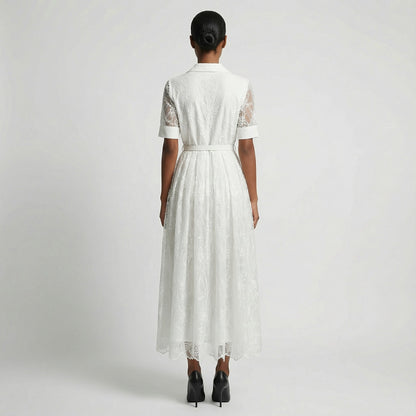 The Margaret dress featuring a long-sleeved ribbed knit bodice and a side-pleated accordion skirt with a matching waist belt in a 135 cm length.