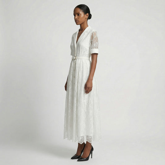 The Margaret dress featuring a long-sleeved ribbed knit bodice and a side-pleated accordion skirt with a matching waist belt in a 135 cm length.