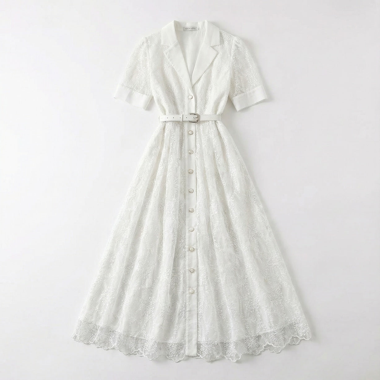 The Margaret dress featuring a long-sleeved ribbed knit bodice and a side-pleated accordion skirt with a matching waist belt in a 135 cm length.