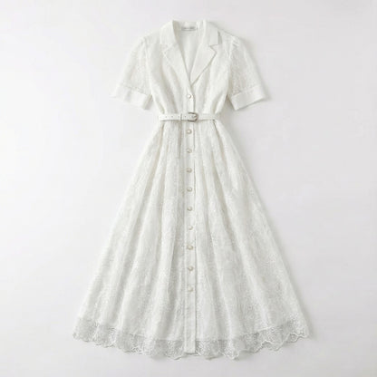 The Margaret dress featuring a long-sleeved ribbed knit bodice and a side-pleated accordion skirt with a matching waist belt in a 135 cm length.