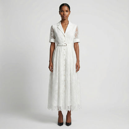 The Margaret dress featuring a long-sleeved ribbed knit bodice and a side-pleated accordion skirt with a matching waist belt in a 135 cm length.