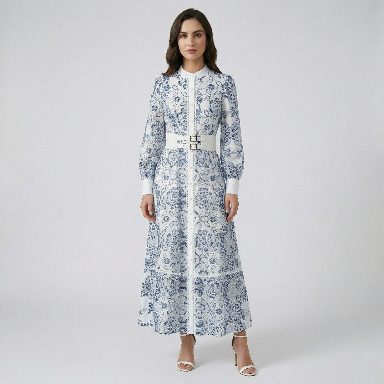 Mary maxi dress featuring blue floral lace, lantern sleeves, and a white double-buckle belt